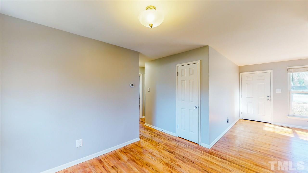 708 Hadley Road Raleigh, NC 27610 - Photo 15 of 20 a view of empty room with wooden floor