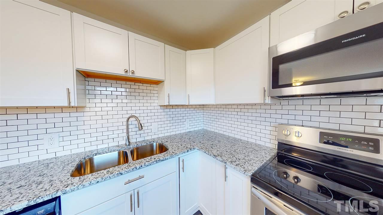 708 Hadley Road Raleigh, NC 27610 - Photo 8 of 20 a kitchen with a sink and cabinets