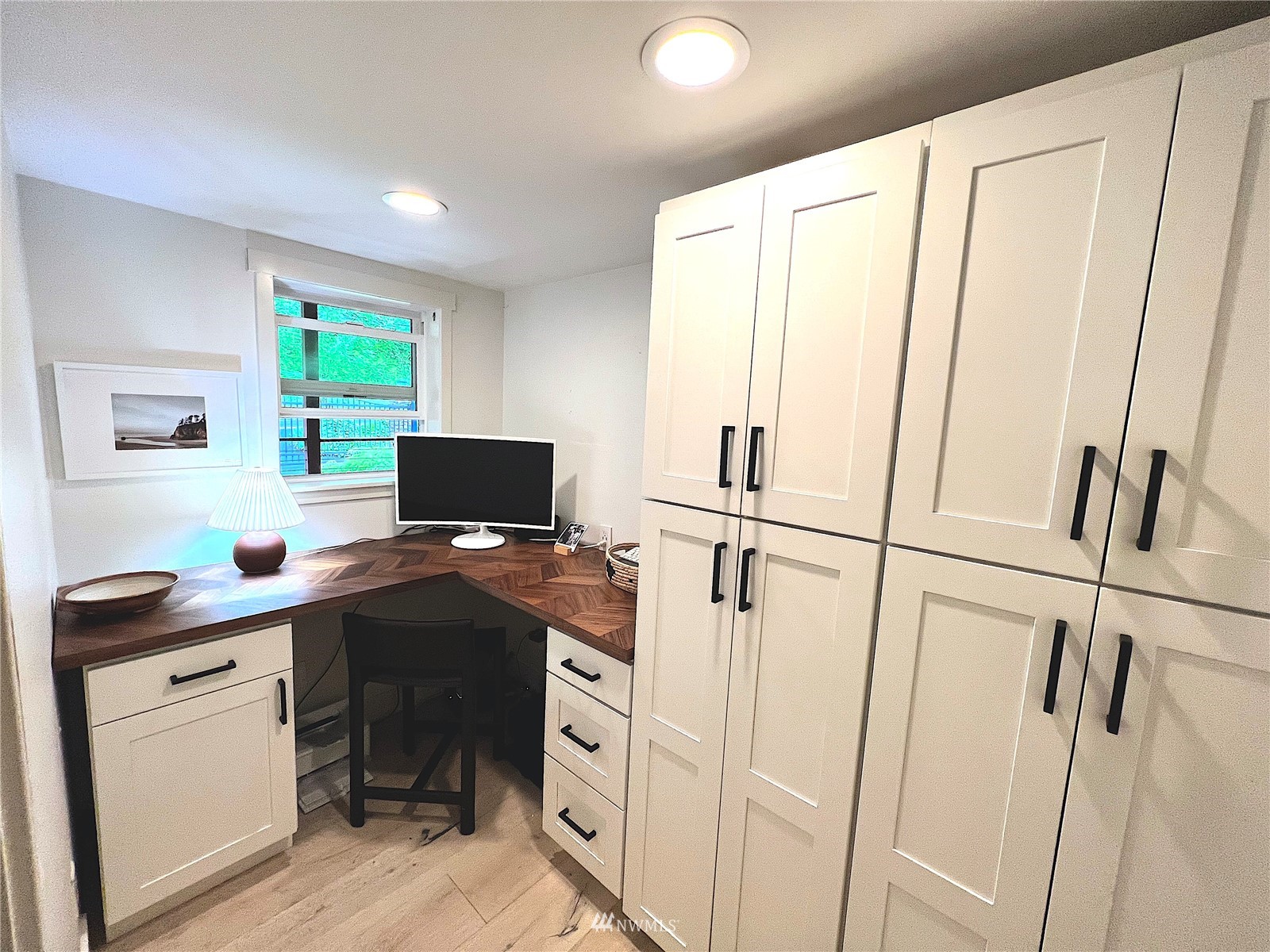 17227 Southeast May Valley Road Renton, WA 98059 - Photo 16 of 40 a view of a workspace with furniture and a window