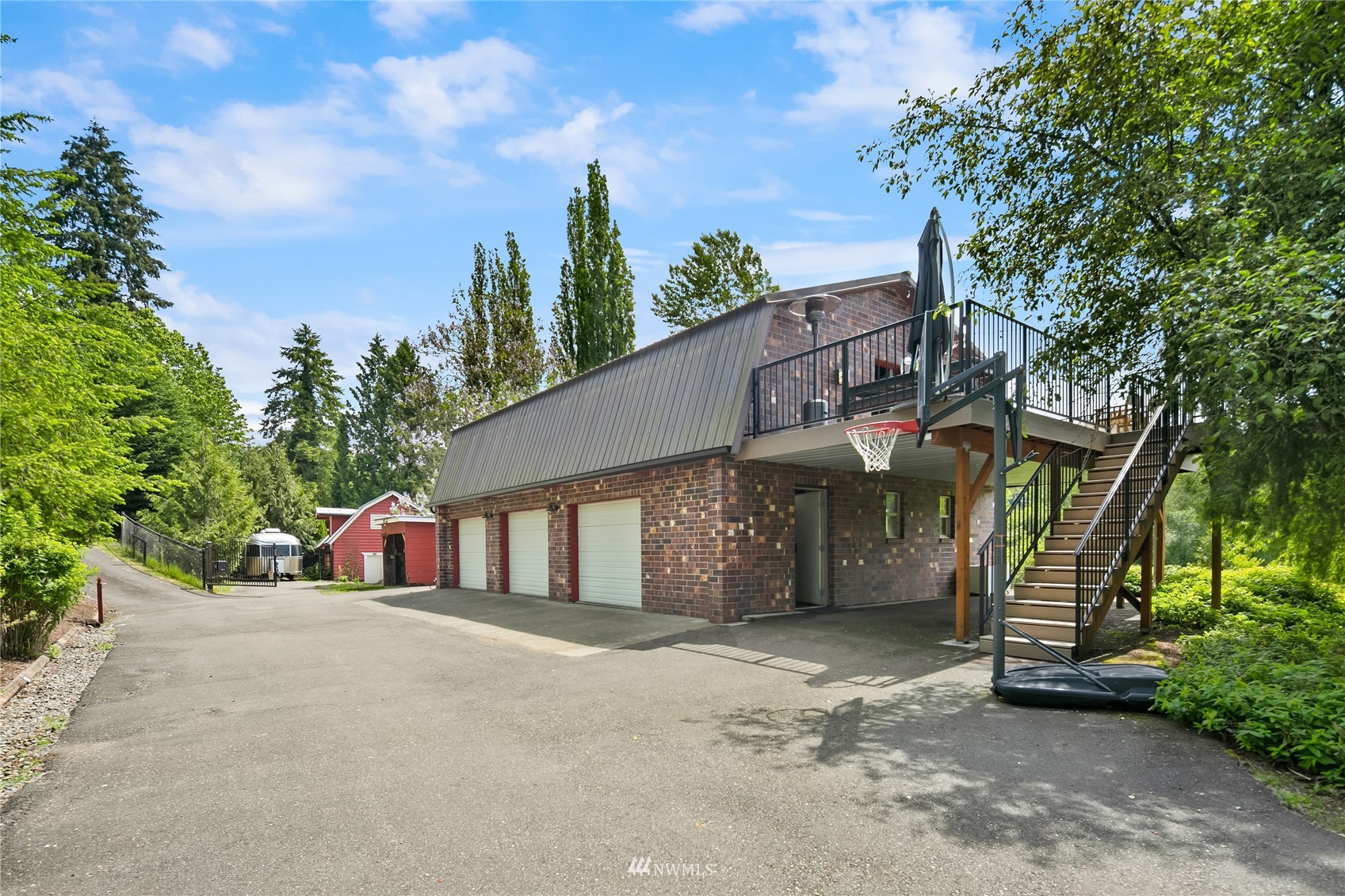 17227 Southeast May Valley Road Renton, WA 98059 - Photo 29 of 40 a view of a house with a yard and tree s