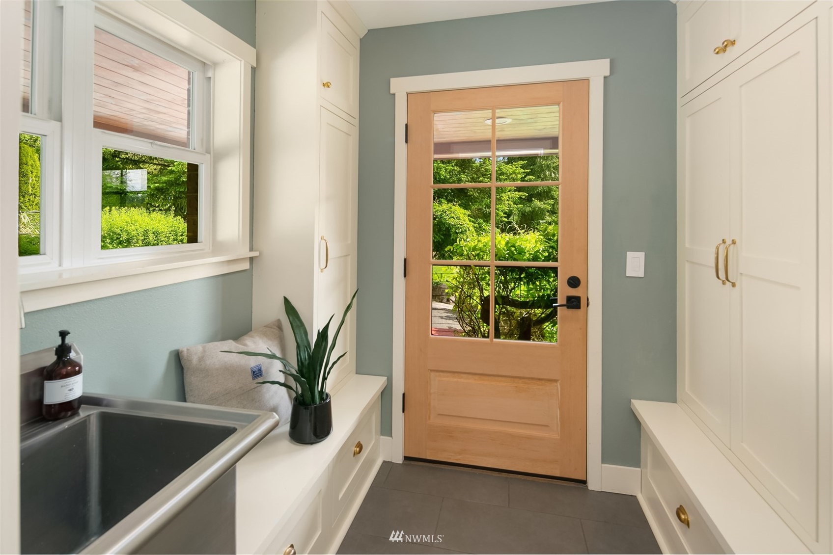 17227 Southeast May Valley Road Renton, WA 98059 - Photo 3 of 40 a bathroom with a tub a sink a potted plant and a window