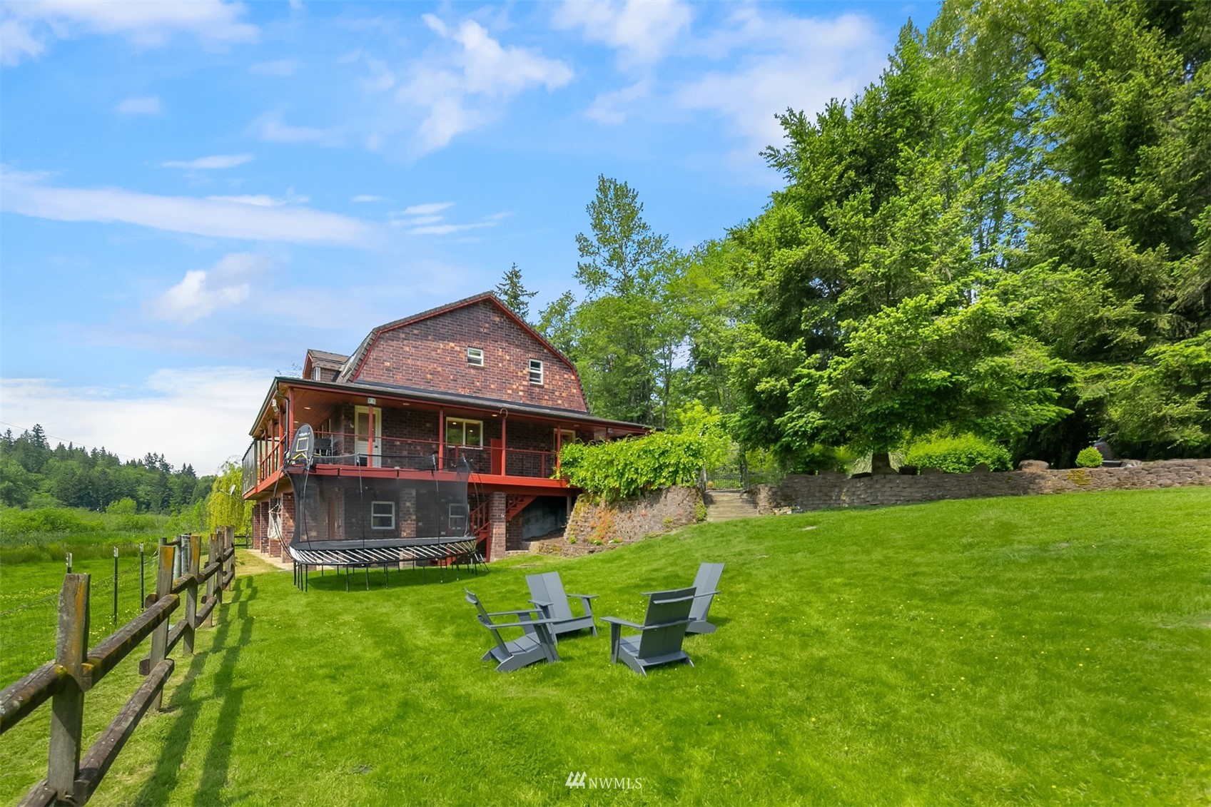 17227 Southeast May Valley Road Renton, WA 98059 - Photo 36 of 40 a front view of a house with garden