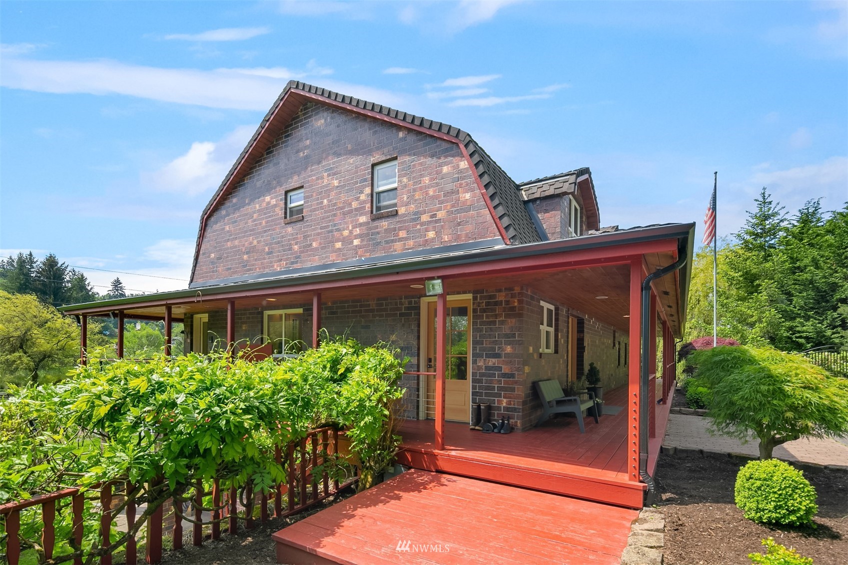 17227 Southeast May Valley Road Renton, WA 98059 - Photo 38 of 40 a front view of a house with a garden
