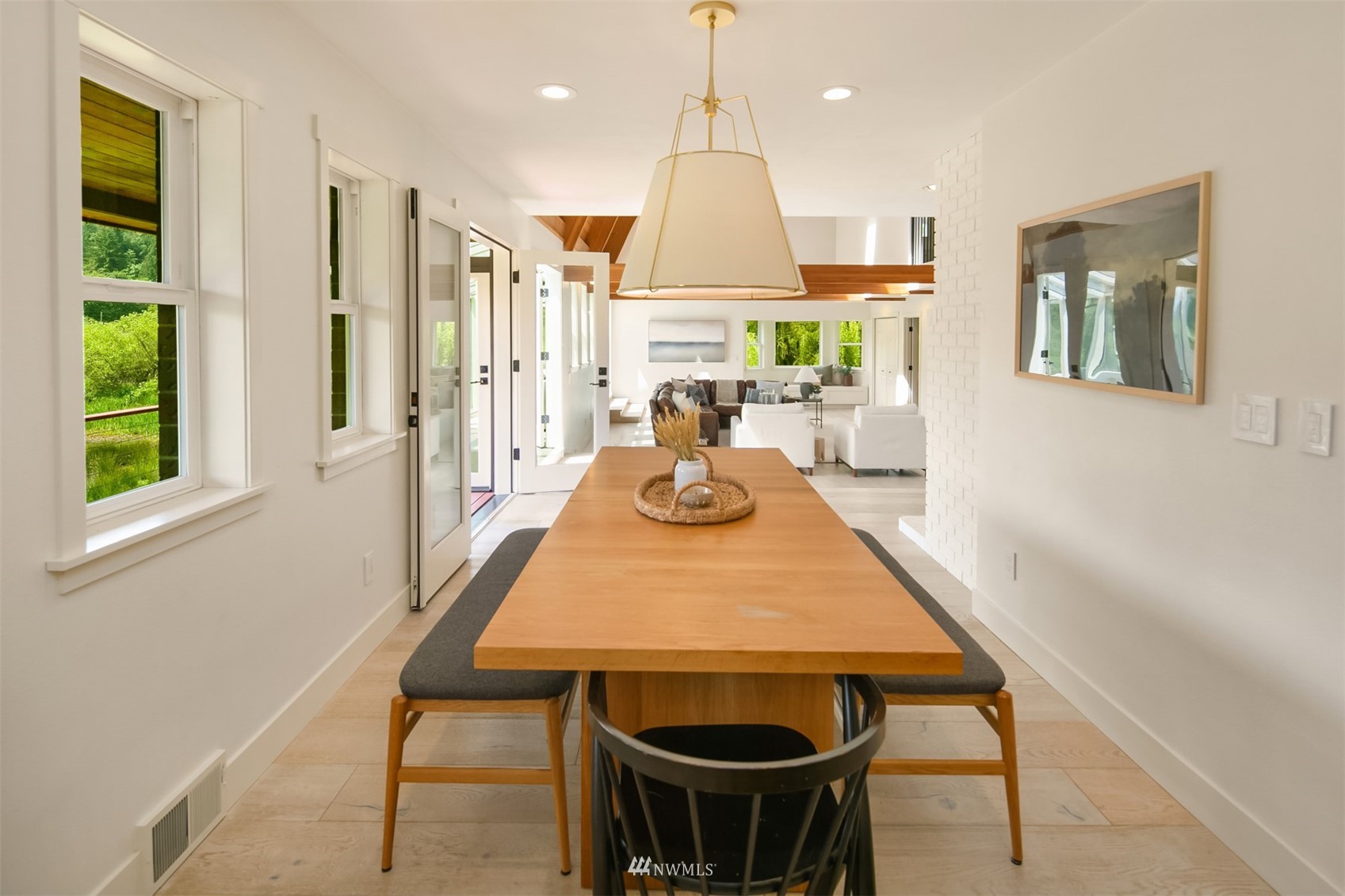 17227 Southeast May Valley Road Renton, WA 98059 - Photo 9 of 40 a view of a dining room with furniture window and wooden floor