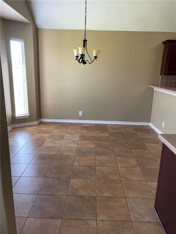 a kitchen with stainless steel appliances a stove a microwave a sink and cabinets