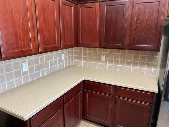 a kitchen with stainless steel appliances a sink and a refrigerator
