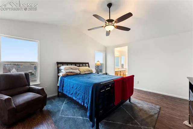 a bedroom with a bed couch and window