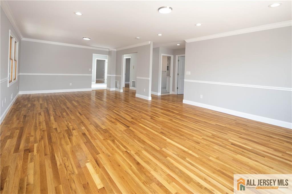 278 Rector Street Perth Amboy, NJ 08861 - Photo 18 of 47 a view of an empty room with wooden floor and a window