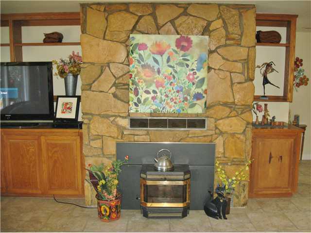 27323 Oakmont Road Valley Center, CA 92082 - Photo 10 of 18 Fireplace with Pellet Stove Insert.