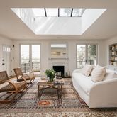 a living room with fireplace furniture and a fireplace