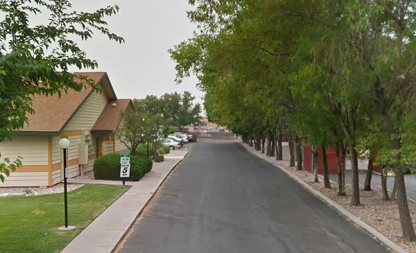 a view of a pathway of a house with a yard