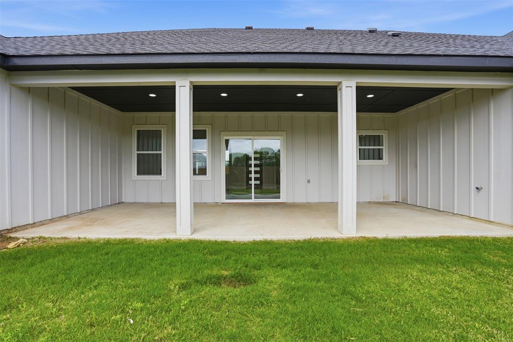 532 Highview Court Godley, TX 76044 - Photo 36 of 39 Covered concrete patio featuring recessed lighting and a sliding glass door