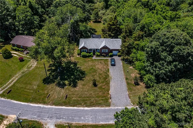 a view of outdoor space with deck and yard