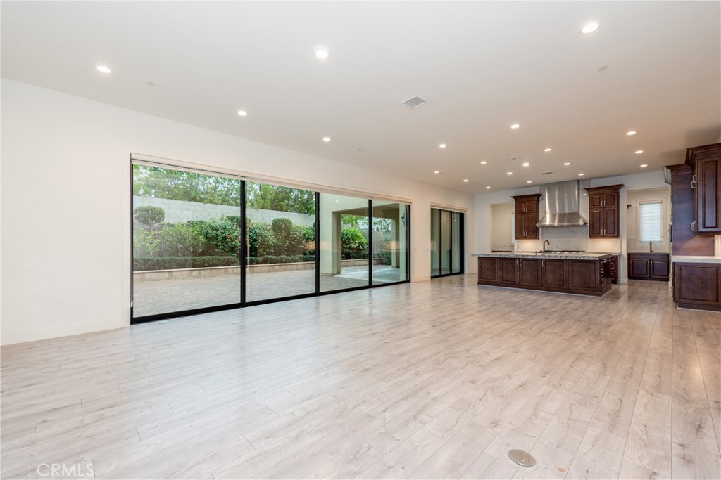 93 Spacial Irvine, CA 92618 - Photo 14 of 32 a view of an empty room with a kitchen