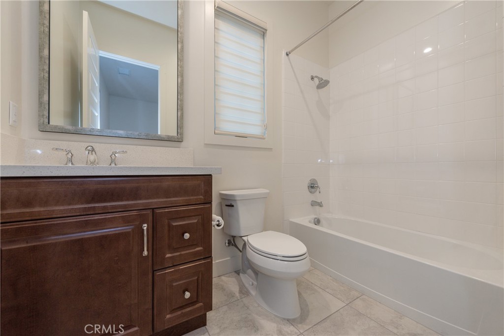 93 Spacial Irvine, CA 92618 - Photo 23 of 32 a bathroom with a sink a toilet and shower