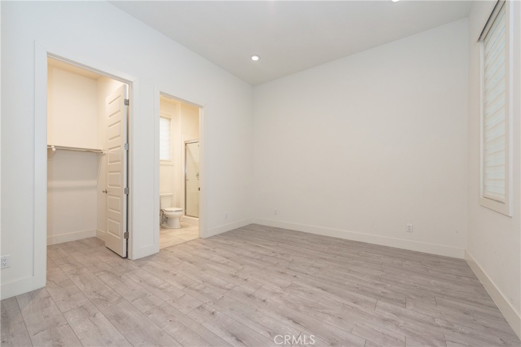 93 Spacial Irvine, CA 92618 - Photo 4 of 32 wooden floor in an empty room