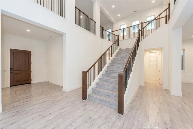 a view of staircase with wooden floor and stairs