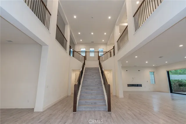 a view of gallery with wooden floor