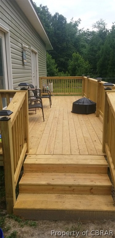 3939 Funny Farm Road Hayes, VA 23072 - Photo 17 of 17 20' x 8' rear deck off of the kitchen and family room.