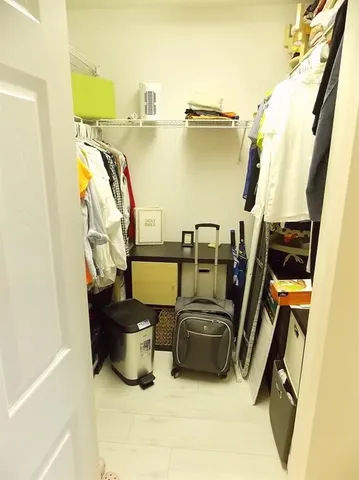 a view of storage and utility room with racks on the wall