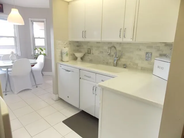 a view of a kitchen with appliances and cabinets