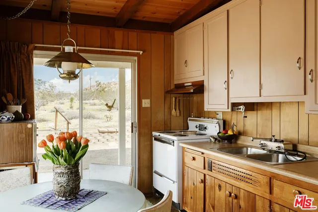 a kitchen with a table and chairs