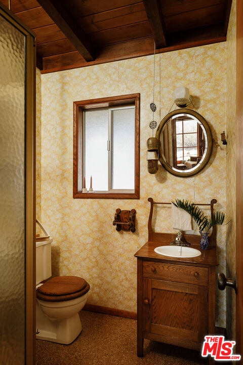 63670 Wagon Wheel Road Joshua Tree, CA 92252 - Photo 20 of 37 a bathroom with a toilet sink and mirror