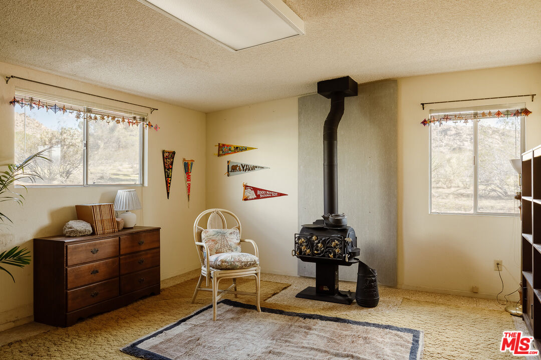 63670 Wagon Wheel Road Joshua Tree, CA 92252 - Photo 25 of 37 a room with furniture and a window