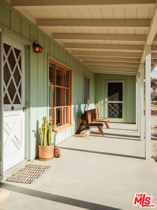 63670 Wagon Wheel Road Joshua Tree, CA 92252 - Photo 28 of 37 a view of a entryway door front of house
