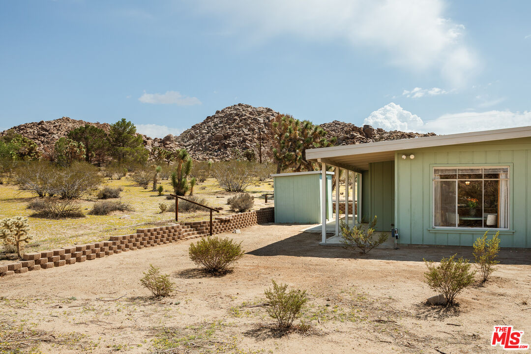 63670 Wagon Wheel Road Joshua Tree, CA 92252 - Photo 30 of 37 a view of a house with a patio