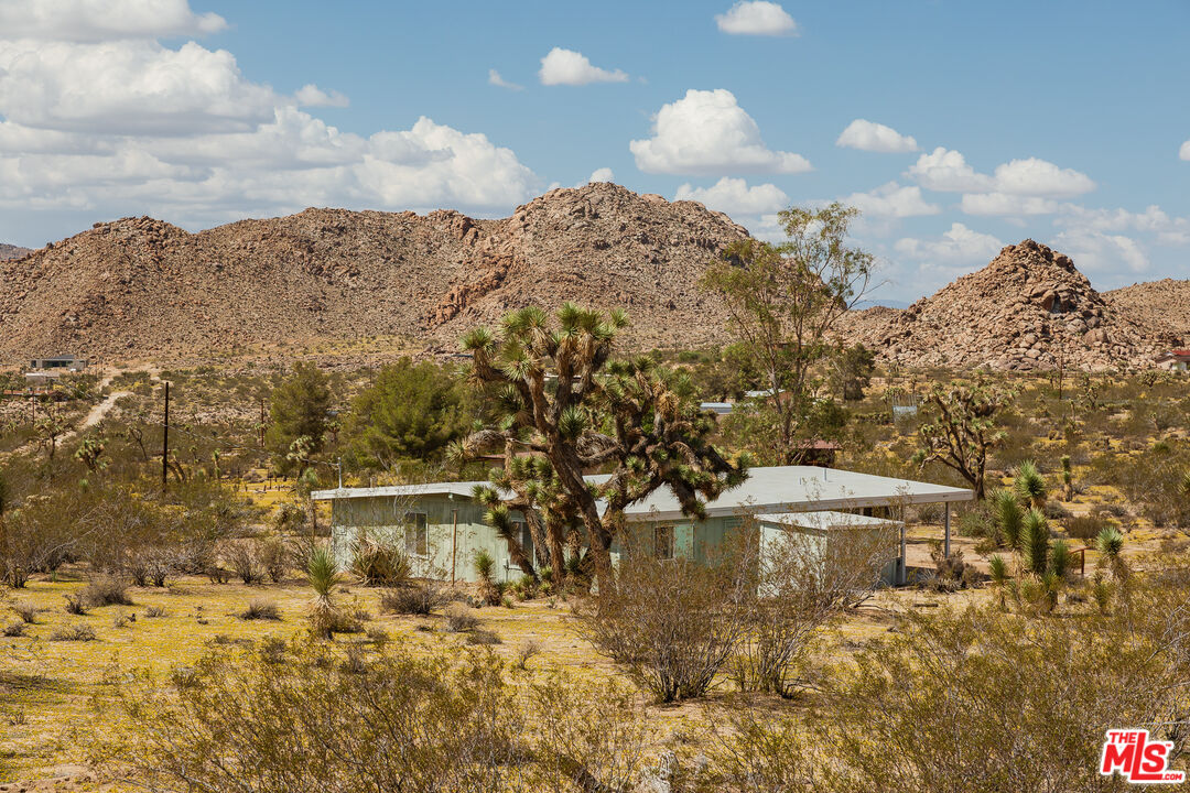 63670 Wagon Wheel Road Joshua Tree, CA 92252 - Photo 32 of 37 a view of a lake with a mountain