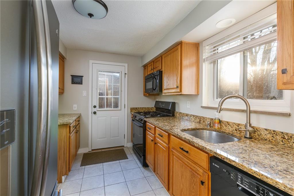 9347 Pannier Road Pittsburgh, PA 15237 - Photo 8 of 25 Kitchen - granite countertops, farm-style sink, gas range, Bosch dishwasher
