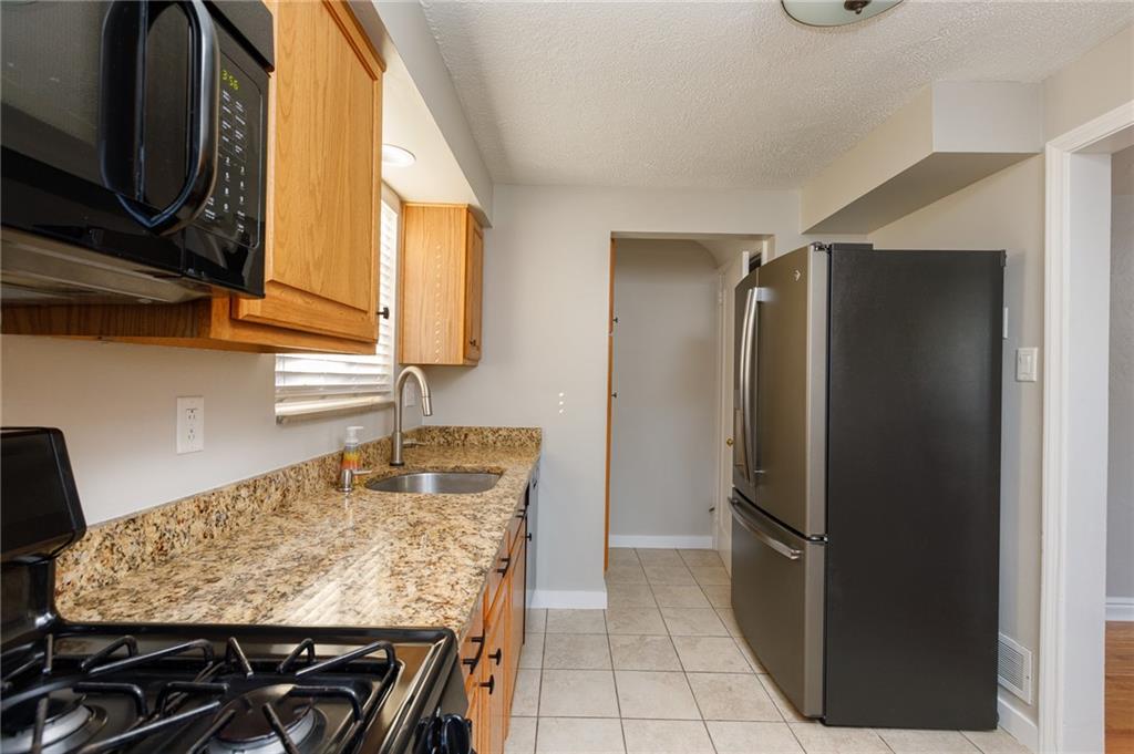 9347 Pannier Road Pittsburgh, PA 15237 - Photo 9 of 25 Kitchen - Stainless steel French door refrigerator, pantry beyond countertop