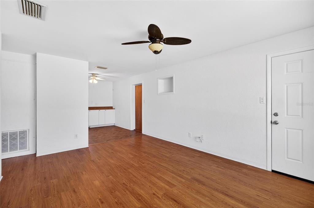 47 Carol Road Ormond Beach, FL 32176 - Photo 3 of 54 a view of empty room with wooden floor