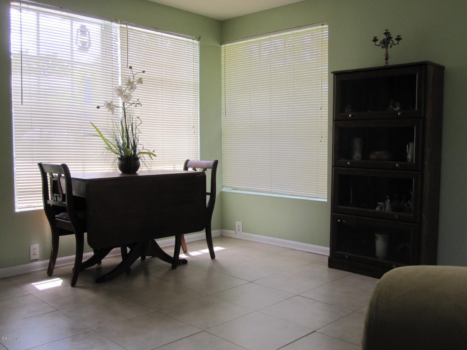 1086 Macco Road Cocoa, FL 32927 - Photo 16 of 23 Sun Room has Window AC Unit