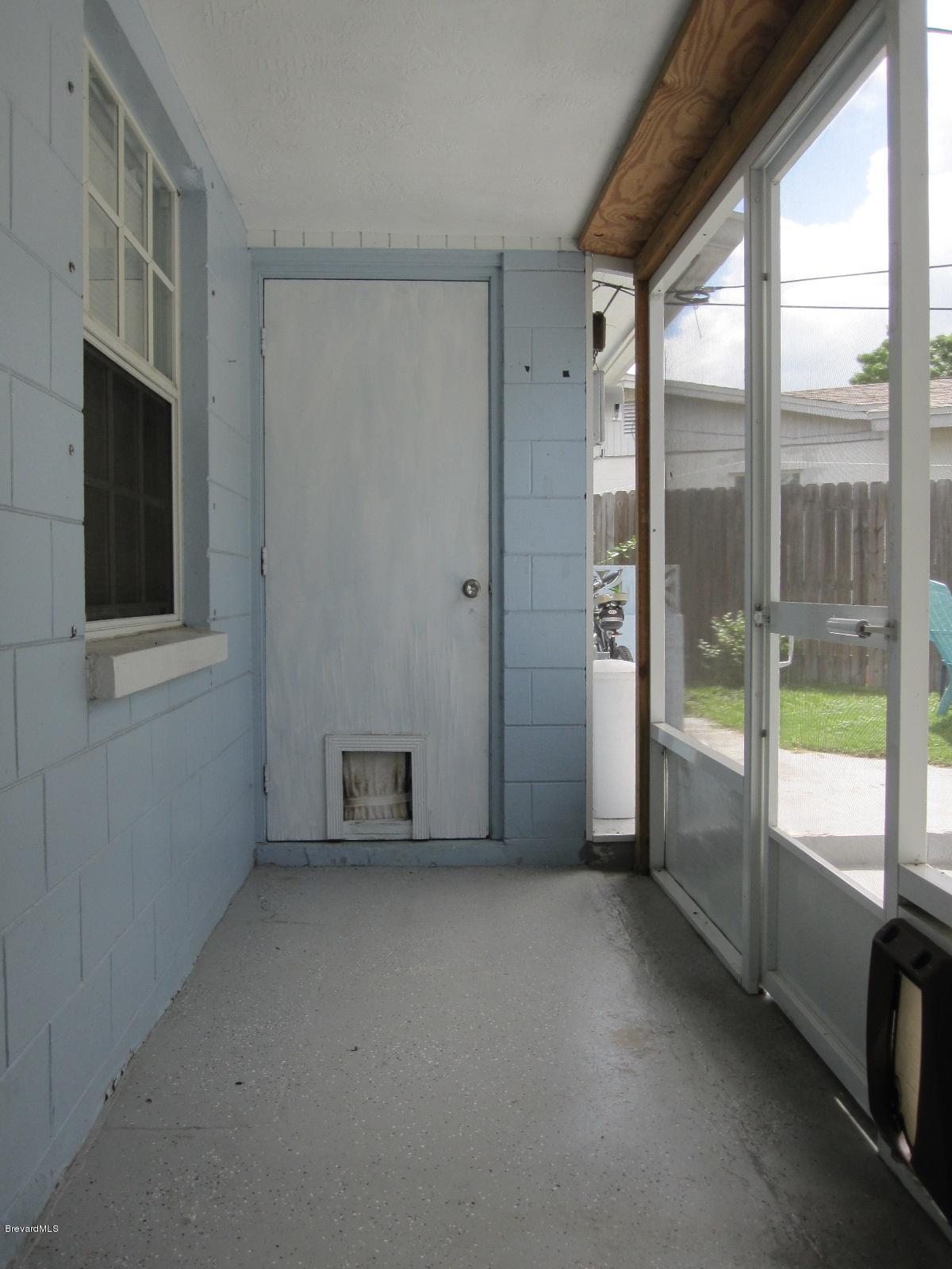 1086 Macco Road Cocoa, FL 32927 - Photo 17 of 23 Screened Walkway to Laundry & Workshop