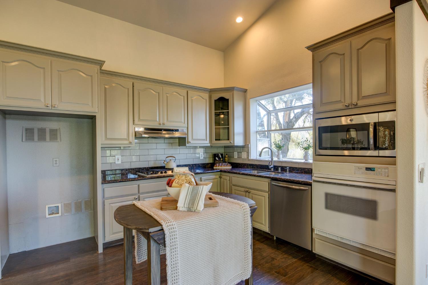 3900 Tawanka Road Somerset, CA 95684 - Photo 11 of 84 a kitchen with stainless steel appliances granite countertop a stove a sink and a microwave