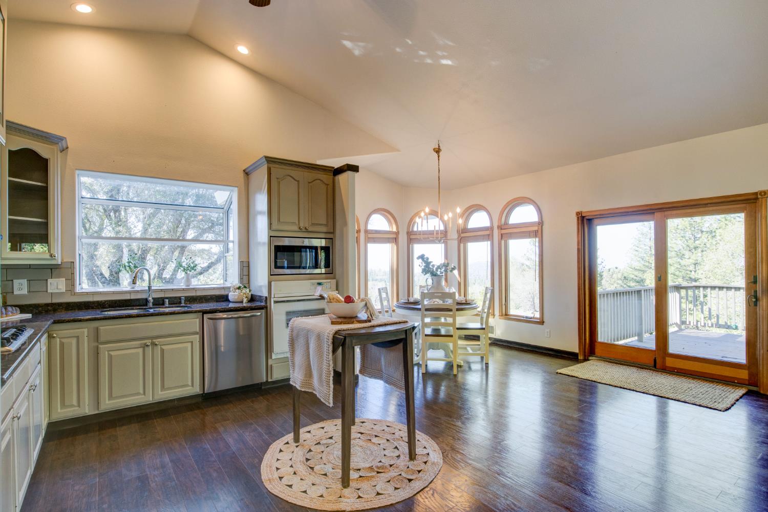 3900 Tawanka Road Somerset, CA 95684 - Photo 12 of 84 a open kitchen with stainless steel appliances granite countertop a stove and a wooden floors