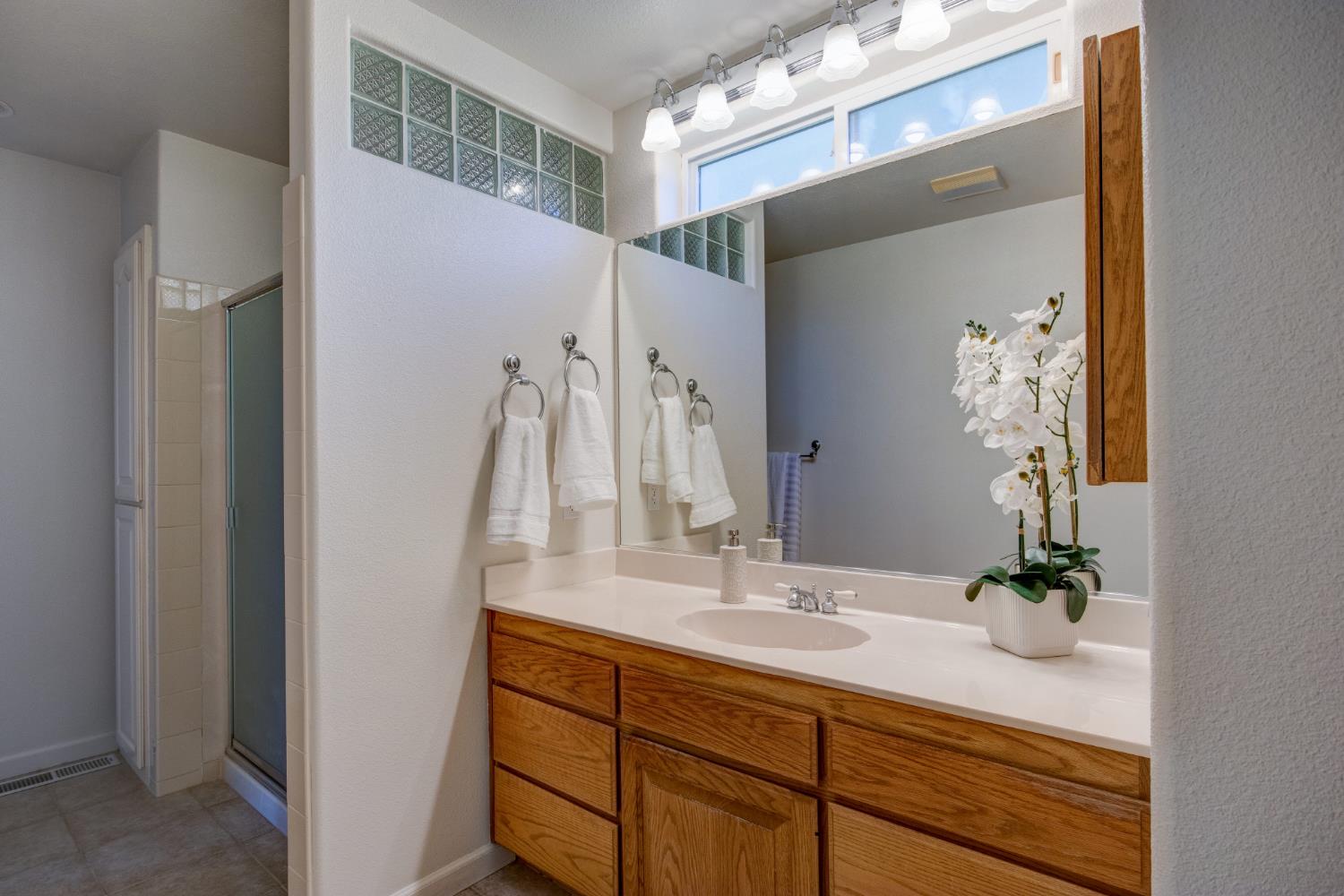 3900 Tawanka Road Somerset, CA 95684 - Photo 20 of 84 a bathroom with a sink and a mirror