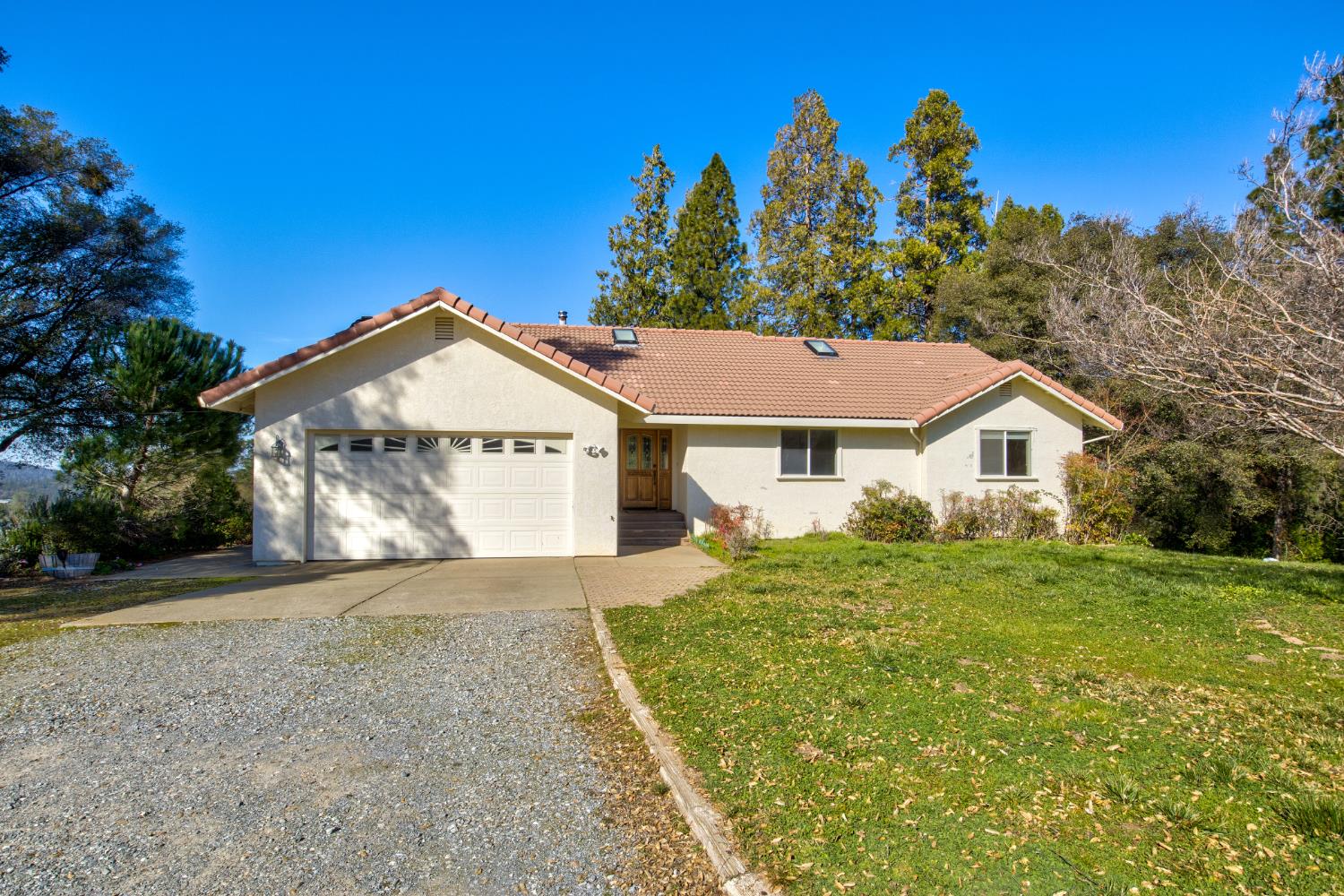 3900 Tawanka Road Somerset, CA 95684 - Photo 2 of 84 a view of a house with a yard and potted plants