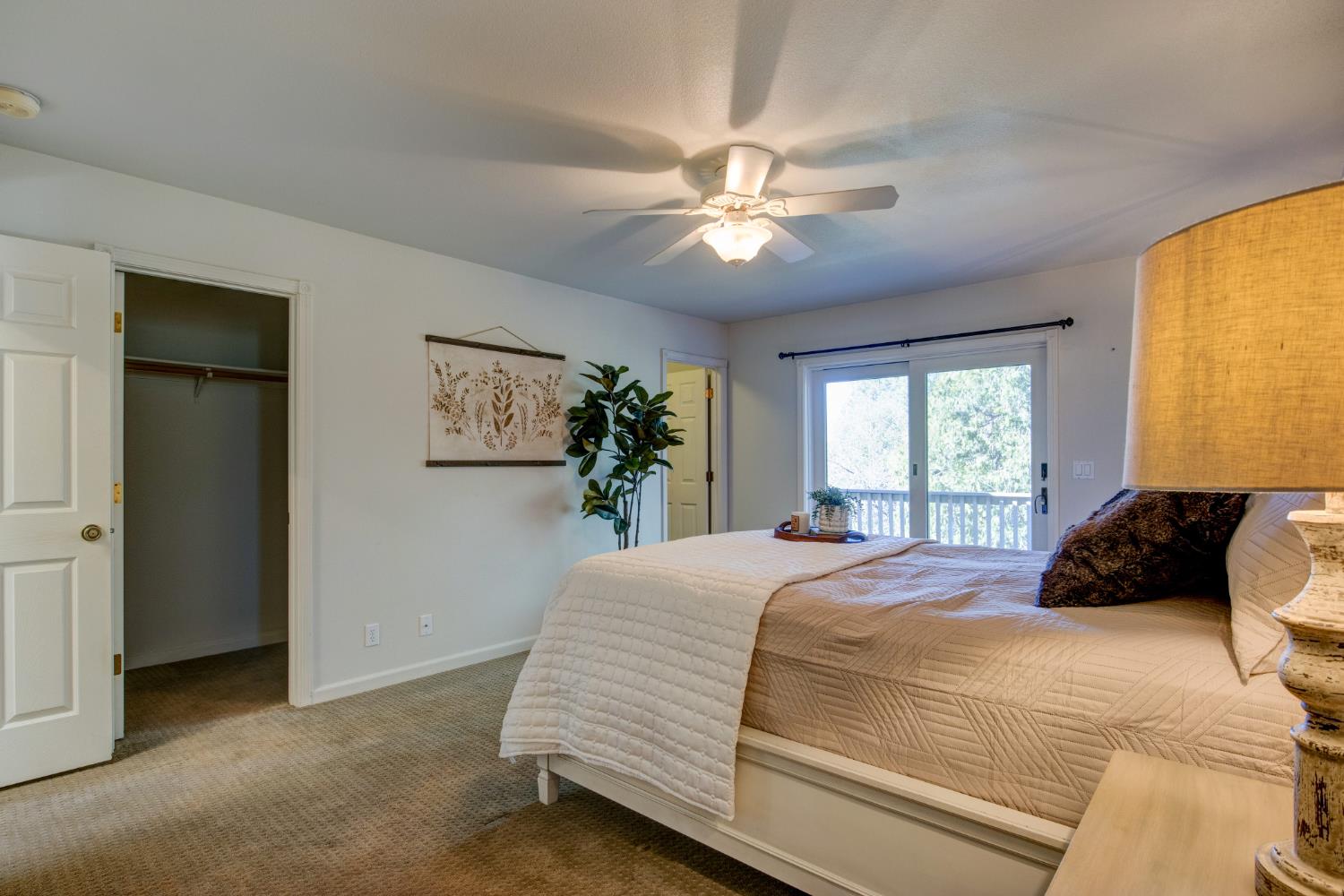 3900 Tawanka Road Somerset, CA 95684 - Photo 22 of 84 a bedroom with a large bed and a chandelier