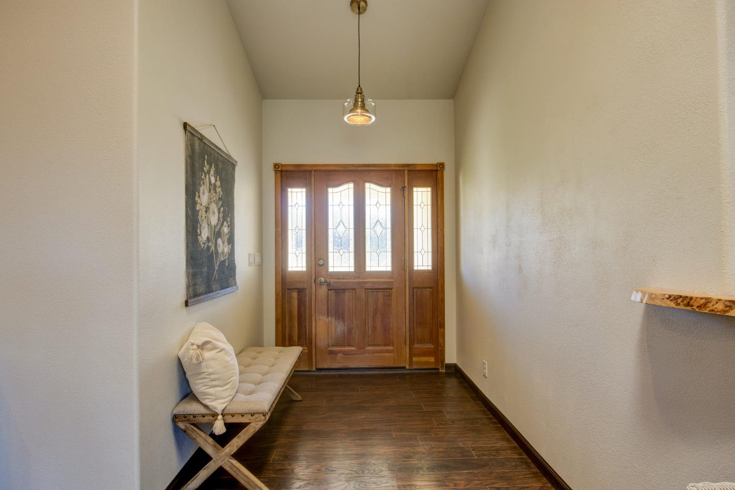 3900 Tawanka Road Somerset, CA 95684 - Photo 3 of 84 a hallway with a chandelier and a window