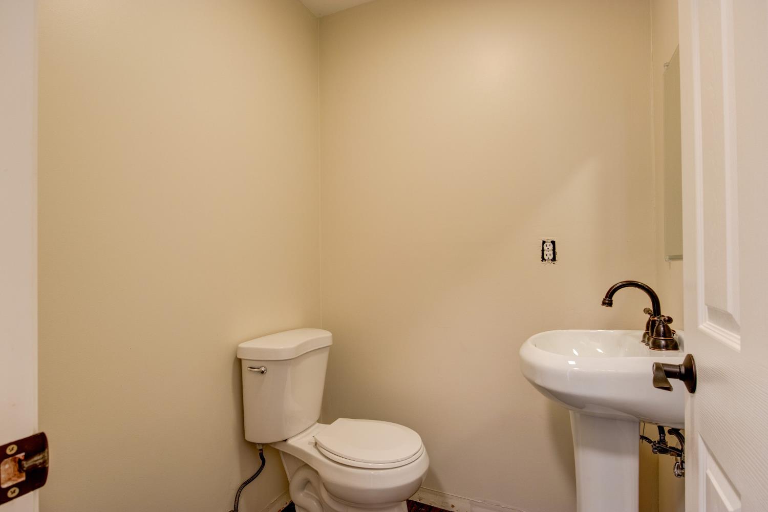 3900 Tawanka Road Somerset, CA 95684 - Photo 32 of 84 a bathroom with a toilet sink and mirror