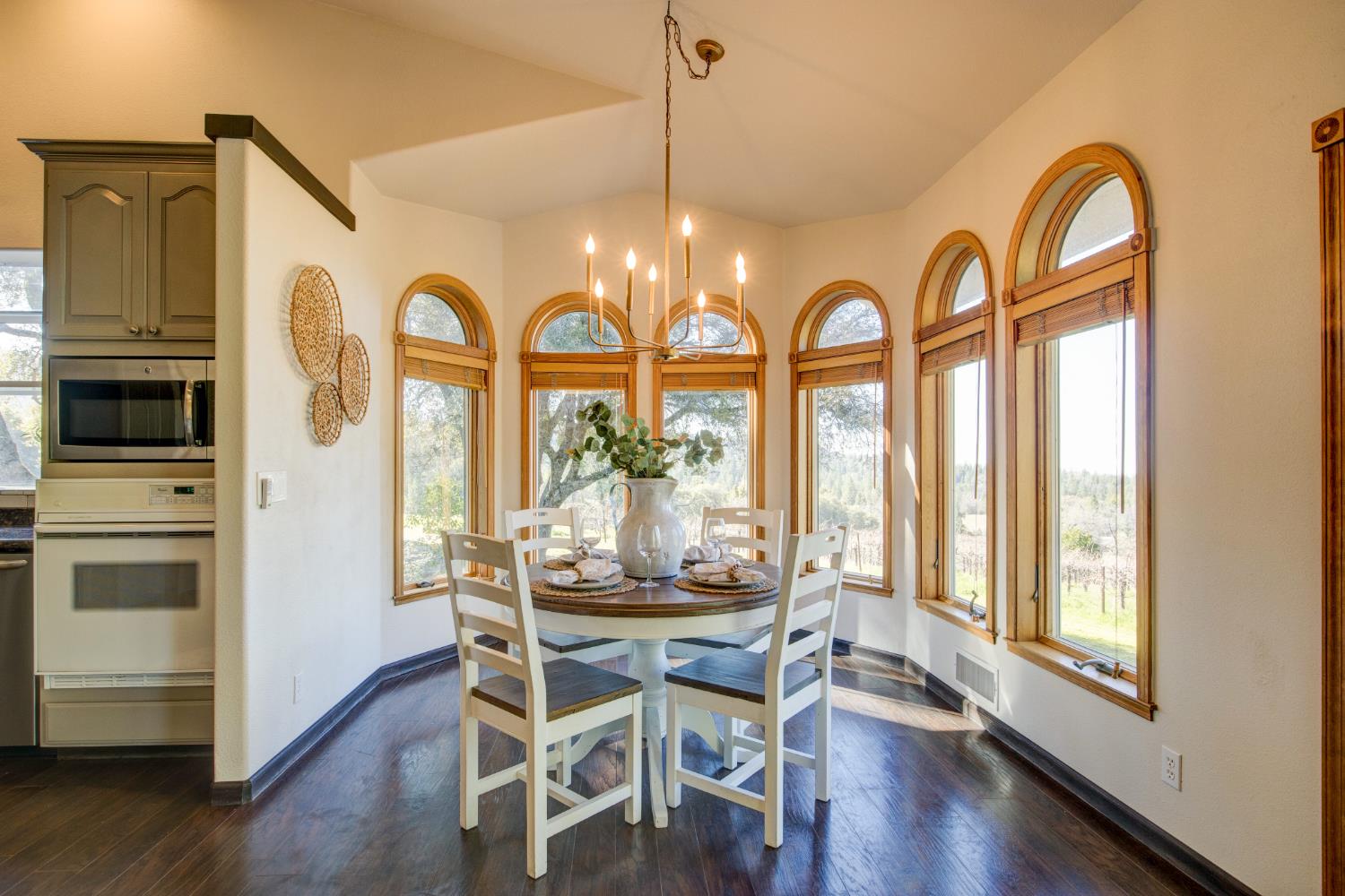 3900 Tawanka Road Somerset, CA 95684 - Photo 9 of 84 a dining room with furniture a chandelier and wooden floor