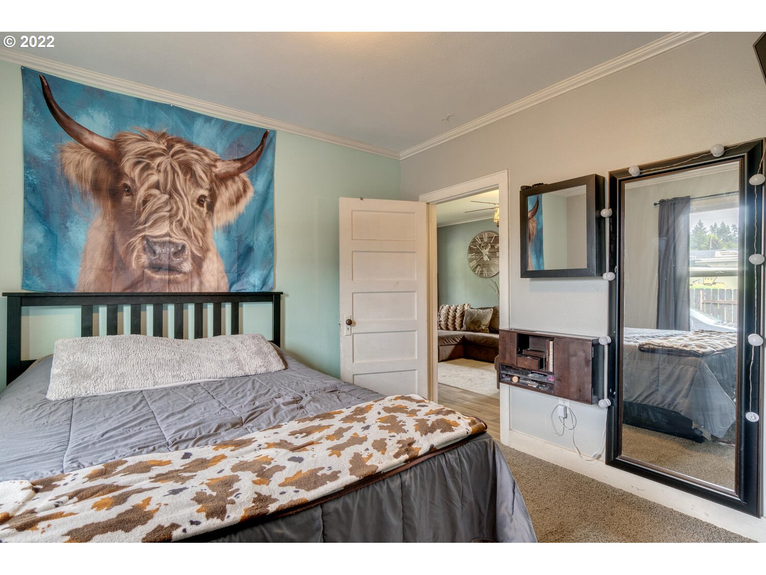 1045 Coal Creek Road Longview, WA 98632 - Photo 15 of 32 a bedroom with a bed and a painting on the wall