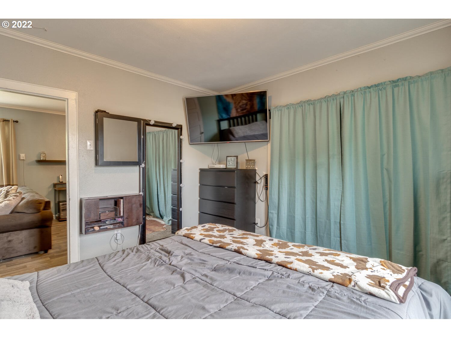 1045 Coal Creek Road Longview, WA 98632 - Photo 16 of 32 a bedroom with a bed and a flat screen tv