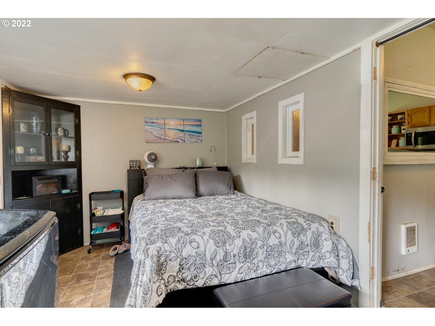 1045 Coal Creek Road Longview, WA 98632 - Photo 23 of 32 a bedroom with a bed and a view of kitchen