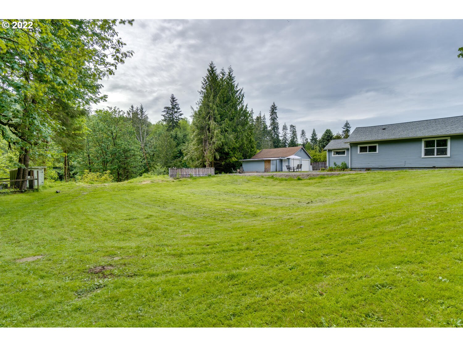 1045 Coal Creek Road Longview, WA 98632 - Photo 32 of 32 a view of a swimming pool with an outdoor space and seating area