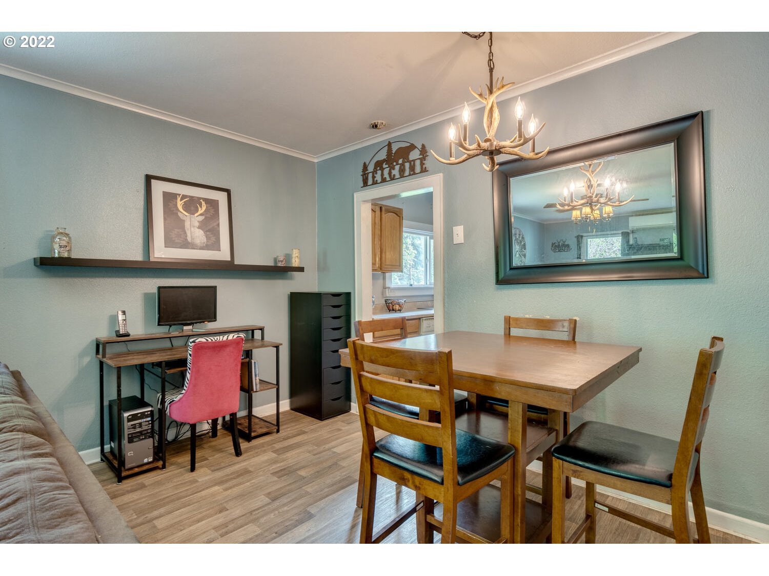 1045 Coal Creek Road Longview, WA 98632 - Photo 10 of 32 a dining room with a wooden table and chairs
