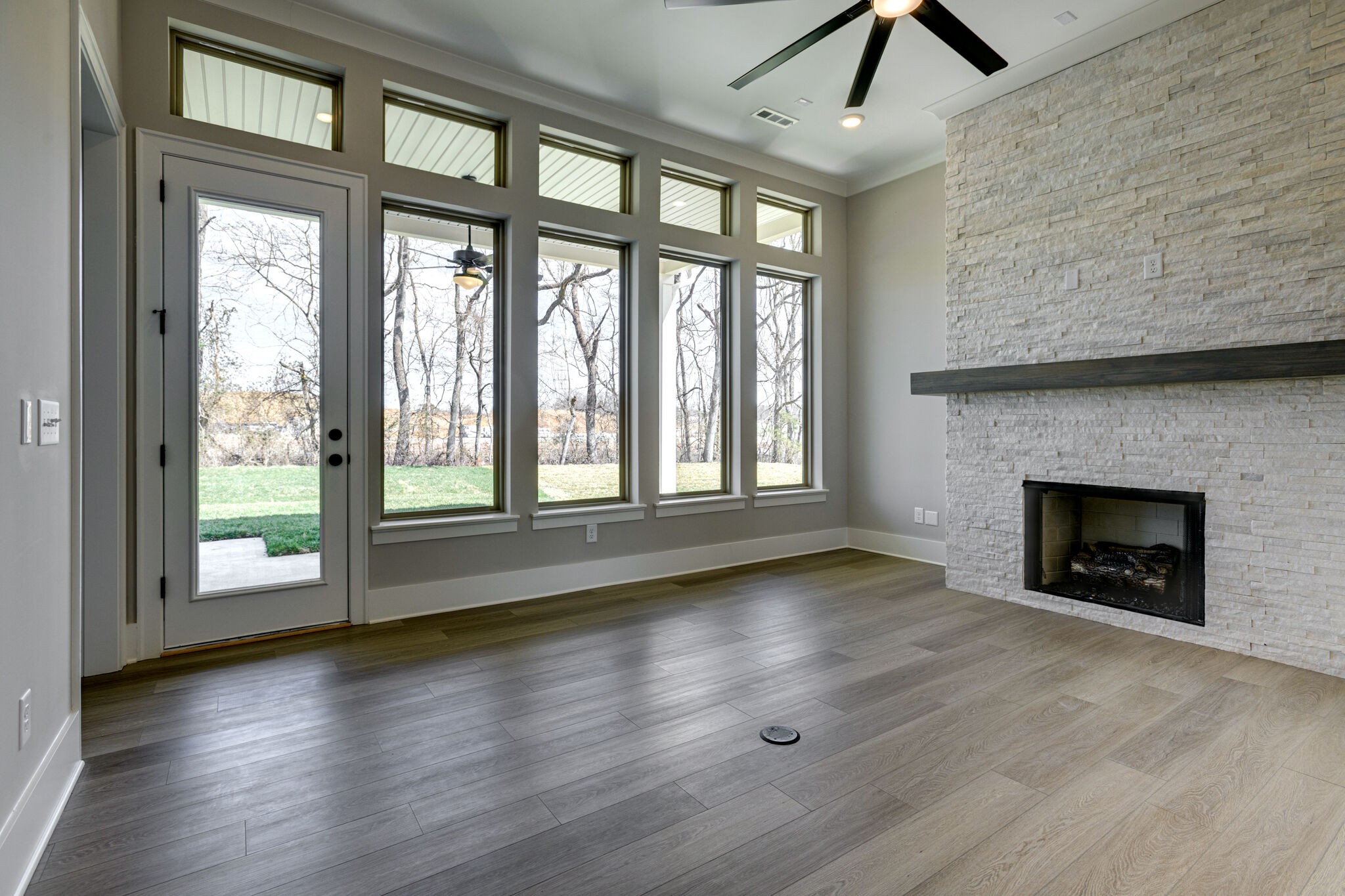 1057 Fallow Road Mount Juliet, TN 37122 - Photo 13 of 41 wooden floor fireplace and windows in an empty room
